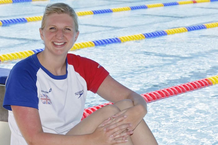 Rebecca Adlington sitting poolside at the BEST Centre
